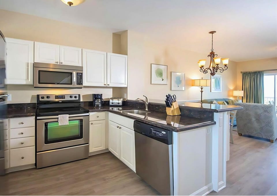 Cook together in the bright kitchen with stainless appliances.