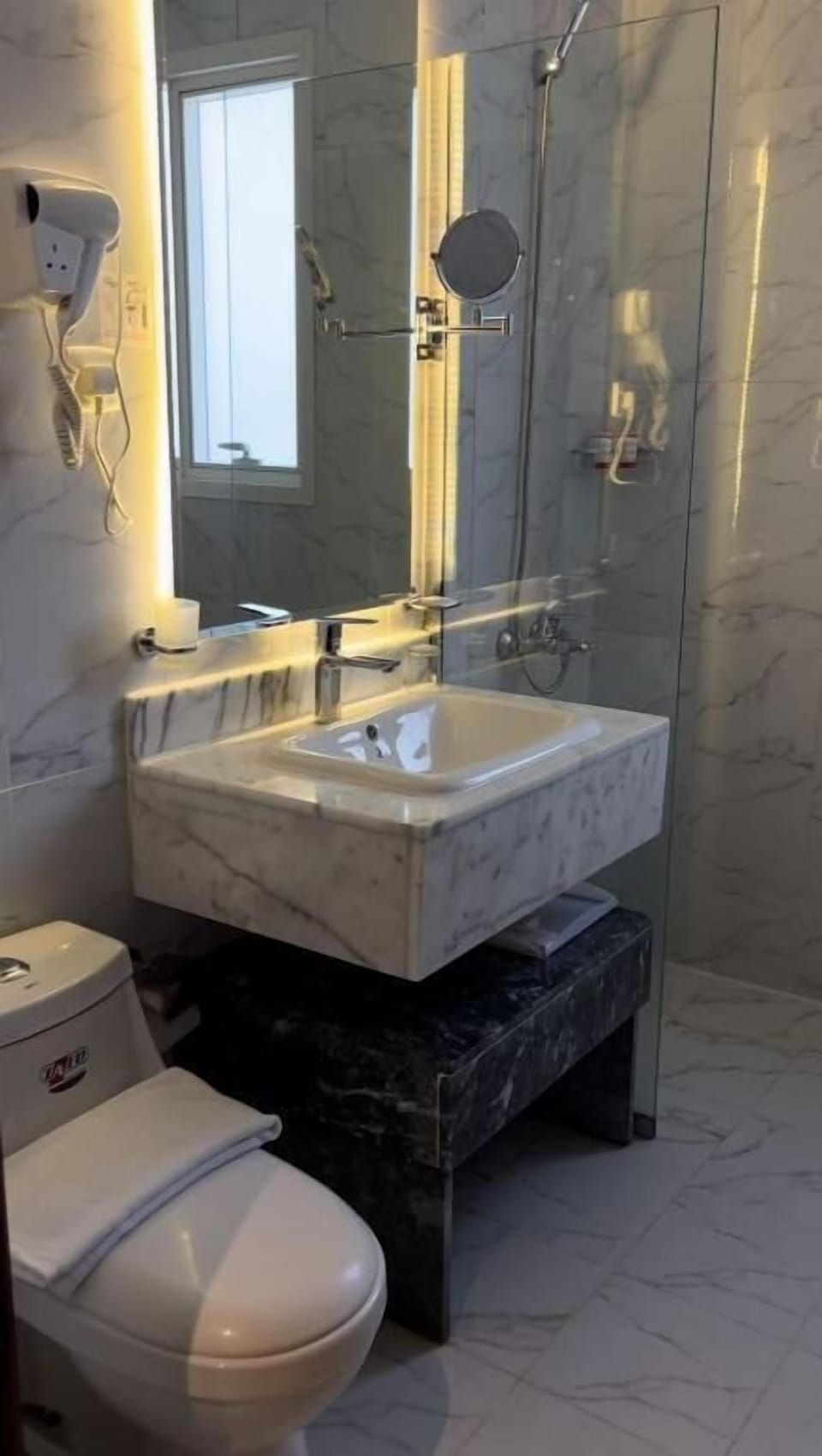 Shower, free toiletries, hair dryer, slippers