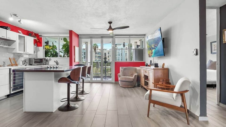 Chic open-concept living and dining area for comfort and entertaining. Enjoy stylish relaxation and meals.