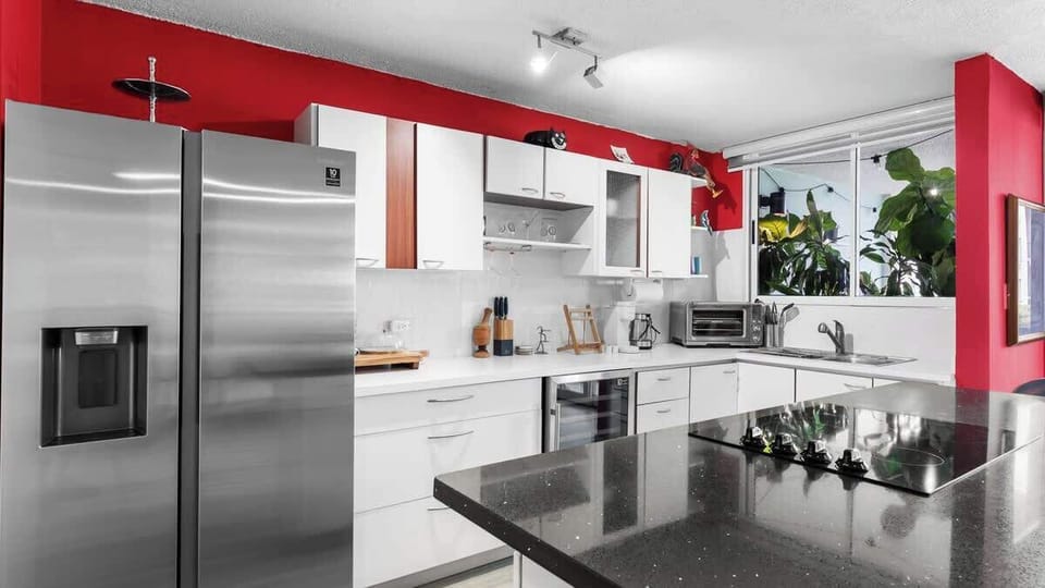 Convenient kitchenette with essential appliances. Perfect for preparing snacks and light meals.