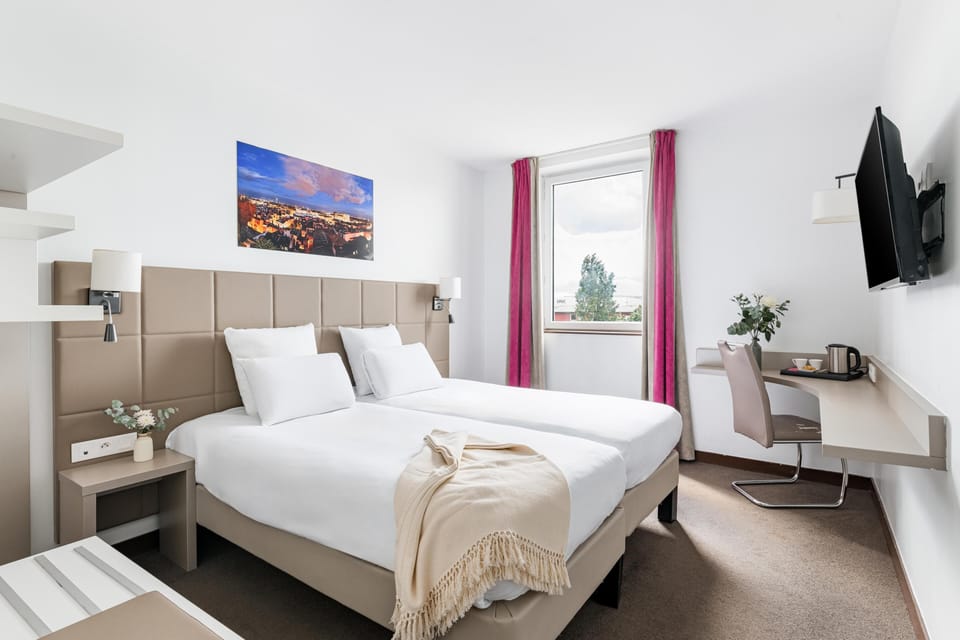 Premium bedding, desk, laptop workspace, soundproofing