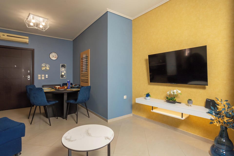Apartment, City View | Living area | 50-inch Smart TV with cable channels