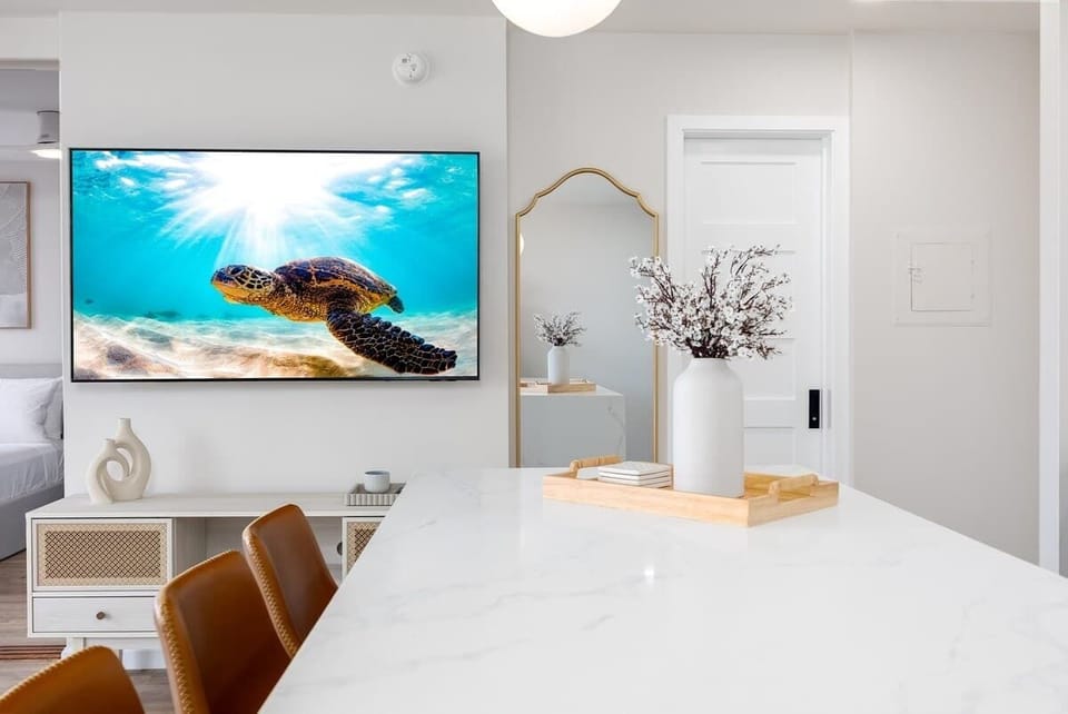 Enjoy entertainment on your 65" smart TV while having your meal.