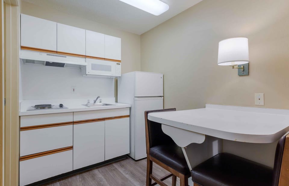 Studio, 1 Queen Bed, Non Smoking | Private kitchen | Coffee/tea maker, full-size fridge, microwave, stovetop