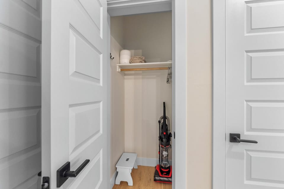 Store your belongings in this spacious closet with built-in shelving and hanging rod, plus convenient cleaning supplies for your stay.