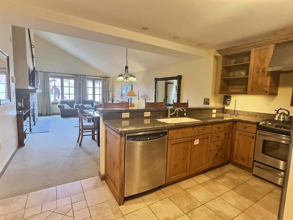 Well supplied open Kitchen with Bar top | Listed with @BookTraverse