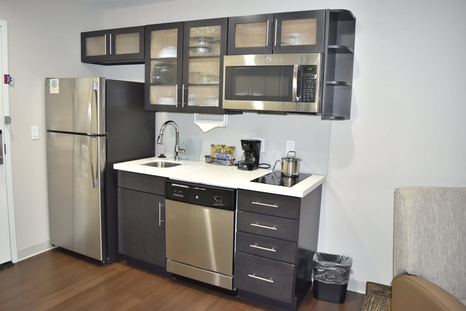 Desk, iron/ironing board, cribs (free), WiFi (free)