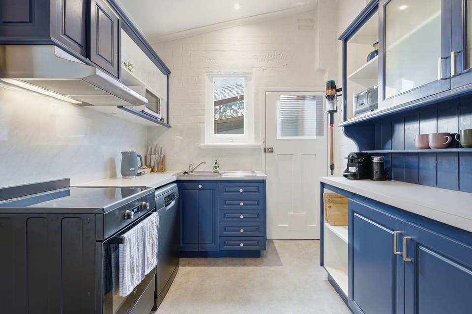 Thoughtful touches like a Nespresso machine, kettle, toaster, and pantry essentials make breakfast easy and enjoyable.