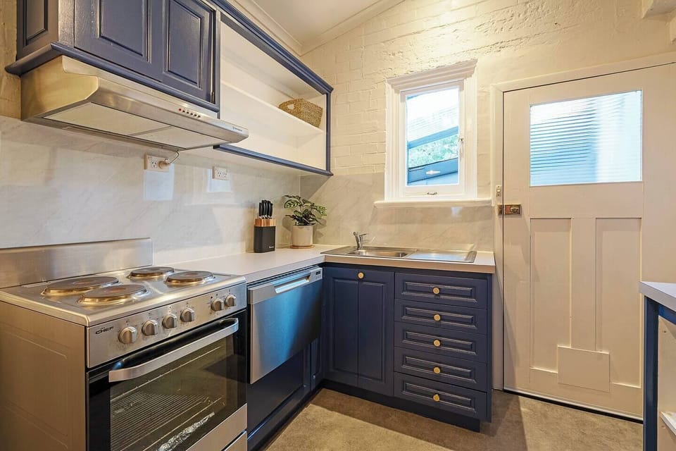 A full-sized oven, stovetop, and generous counter space make preparing meals a breeze.