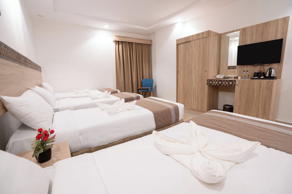 Quadruple Room | Minibar, soundproofing, iron/ironing board (on request), WiFi (free)