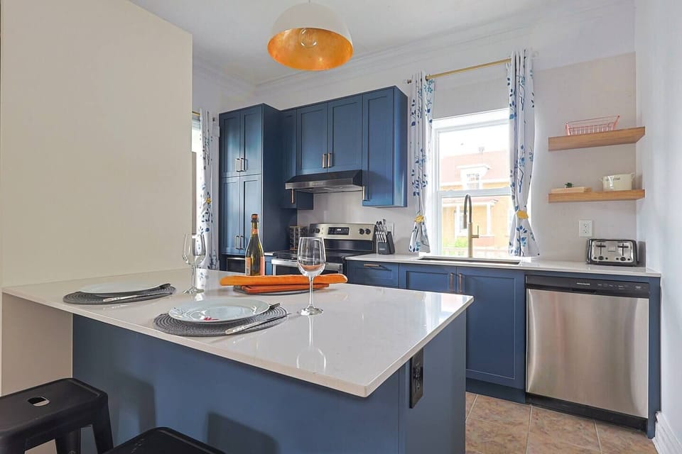 Renovated kitchen with a modern feel, practical island, stainless steel appliances and a warm atmosphere. (1)