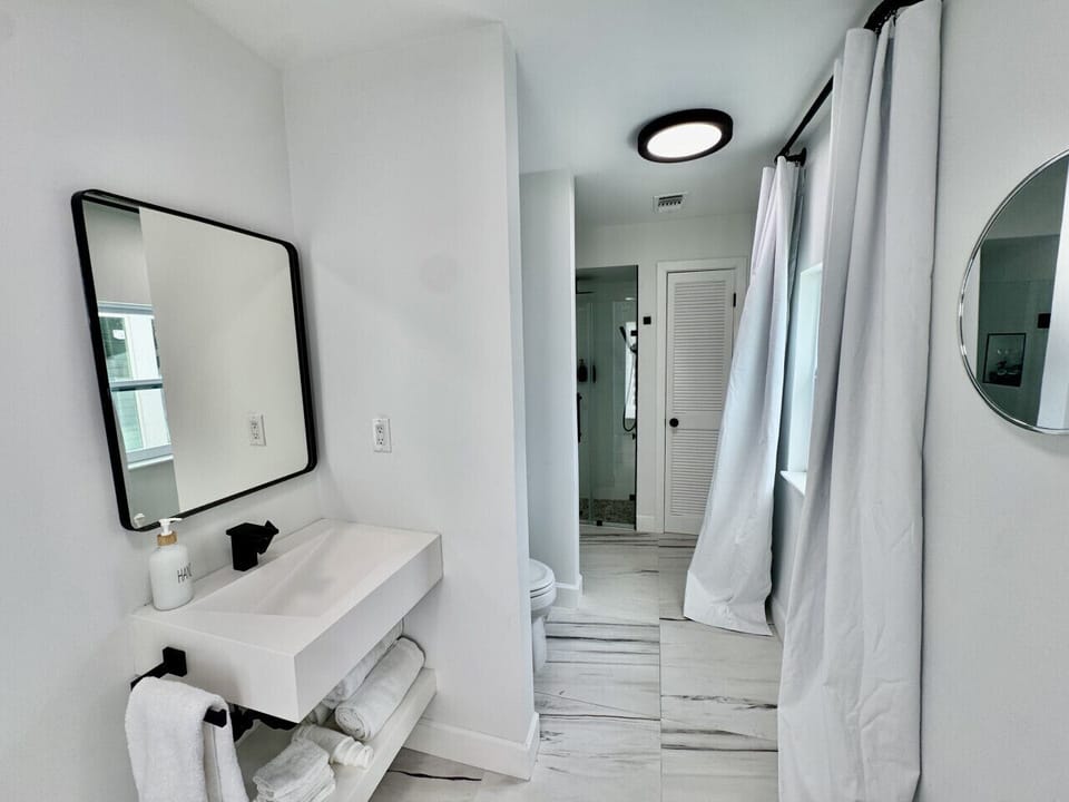 Downstairs Shower & Full Bathroom Pool Level