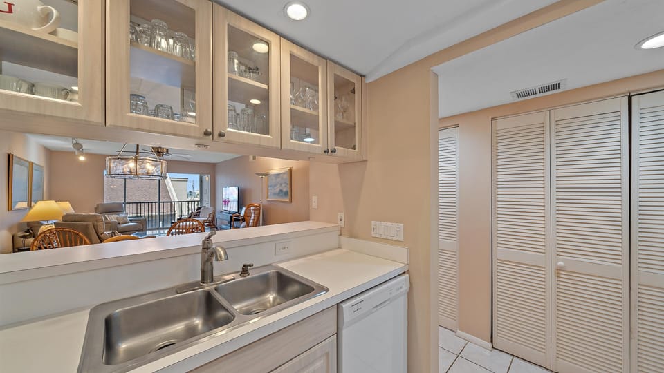 Dishwasher and laundry room right off the kitchen area for convenience.