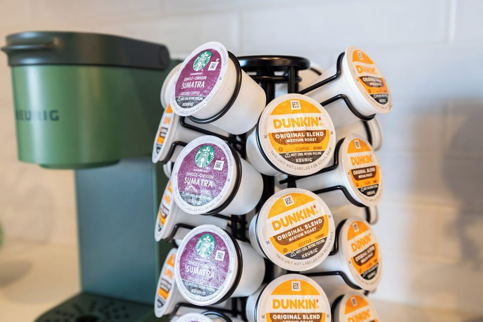Keurig coffee station, complete with Dunkin and Starbucks starter pack flavors