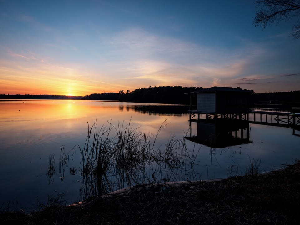 Beautiful sunset overlooking the neighbors pier towards the island.