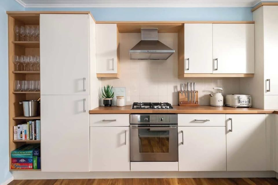 Open shelves, and everything you need - from wine glasses to board games.