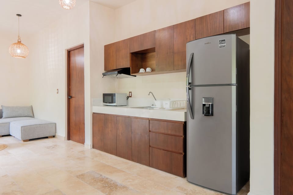 Family Apartment, Patio, Garden View | Private kitchen | Mini-fridge