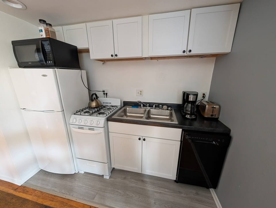 Kitchen appliances including a dishwasher.