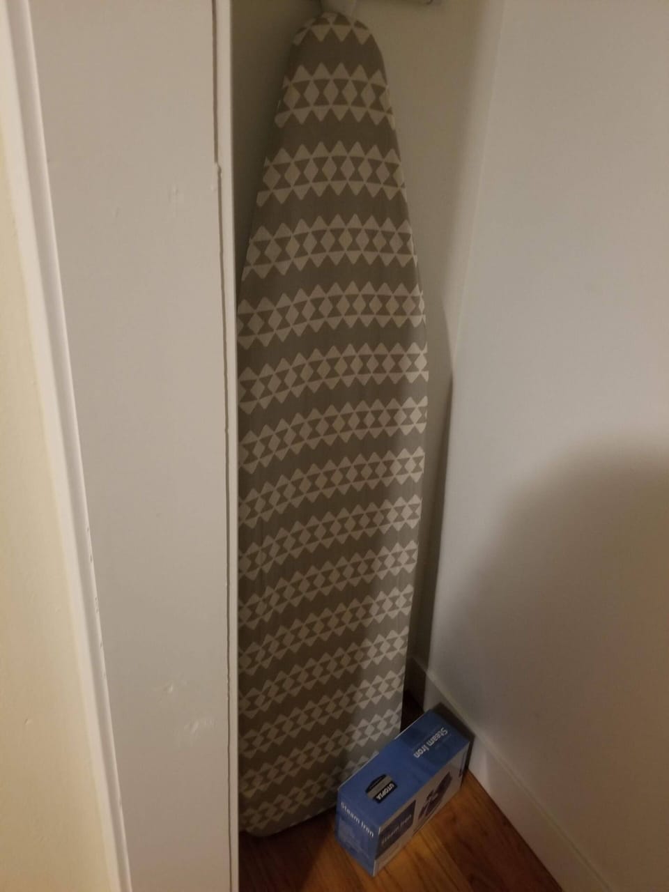 Ironing set in bedroom closet