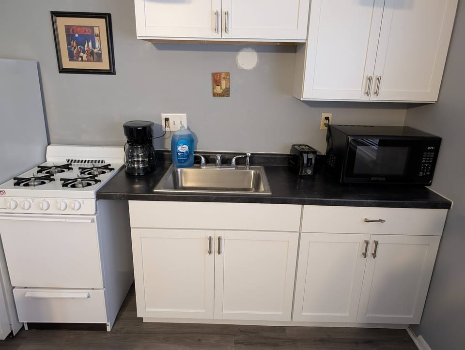 Kitchen has coffee maker and toaster