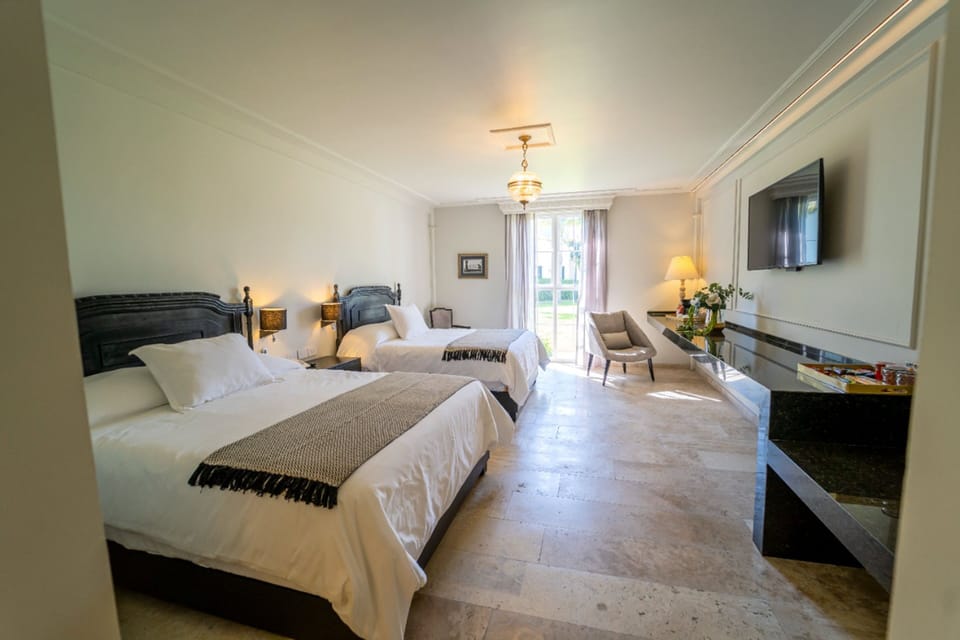 Contemporary Suite | 20 bedrooms, premium bedding, down comforters, in-room safe