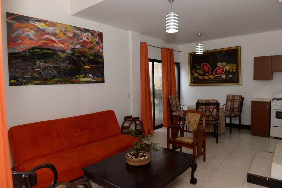 Deluxe Apartment, 1 King Bed | Living area | 32-inch LCD TV with cable channels, plasma TV