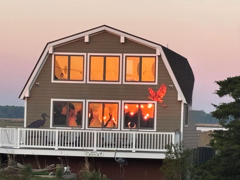 Sun rise reflecting on the front of the cottage