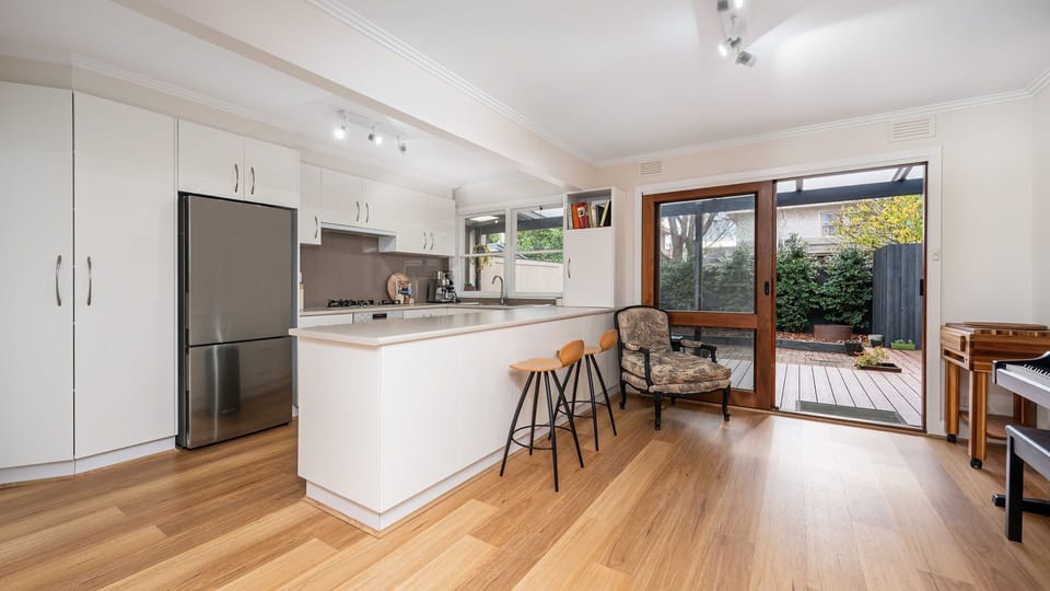 Breakfast bar with seating for 3 and access through to the outdoor decking