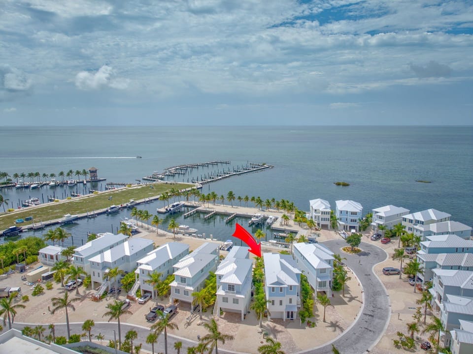 Drone capture of this upscale vacation home right on the Gulf in Marathon, with spacious outdoor living and deepwater dockage.