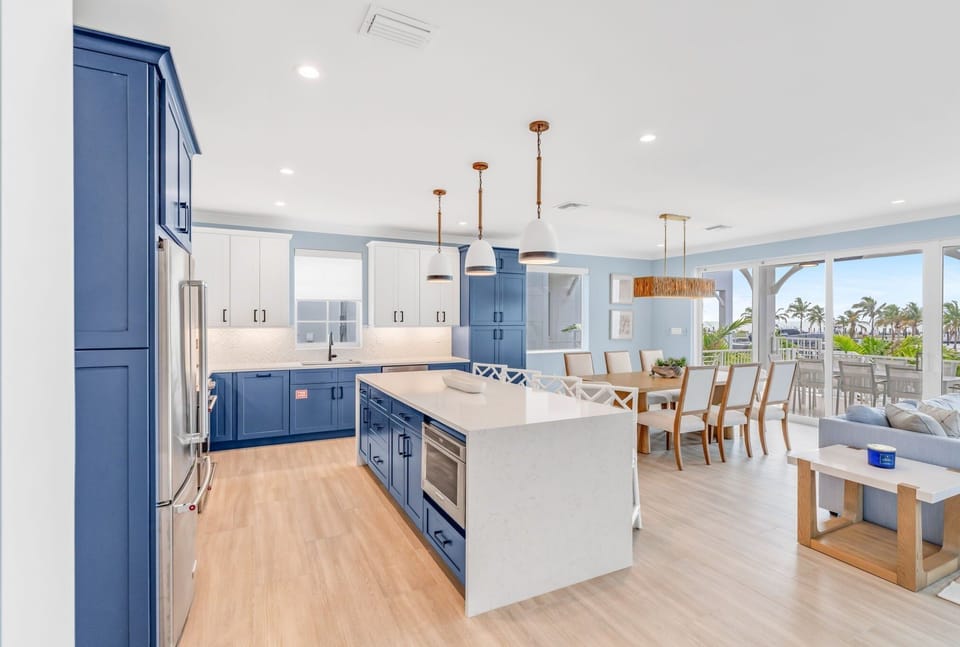 Whether you're prepping a seafood feast or morning coffee, this fully stocked kitchen has it all. Set in a luxury vacation rental with private pool and dock, this kitchen brings together convenience, comfort, and coastal charm.