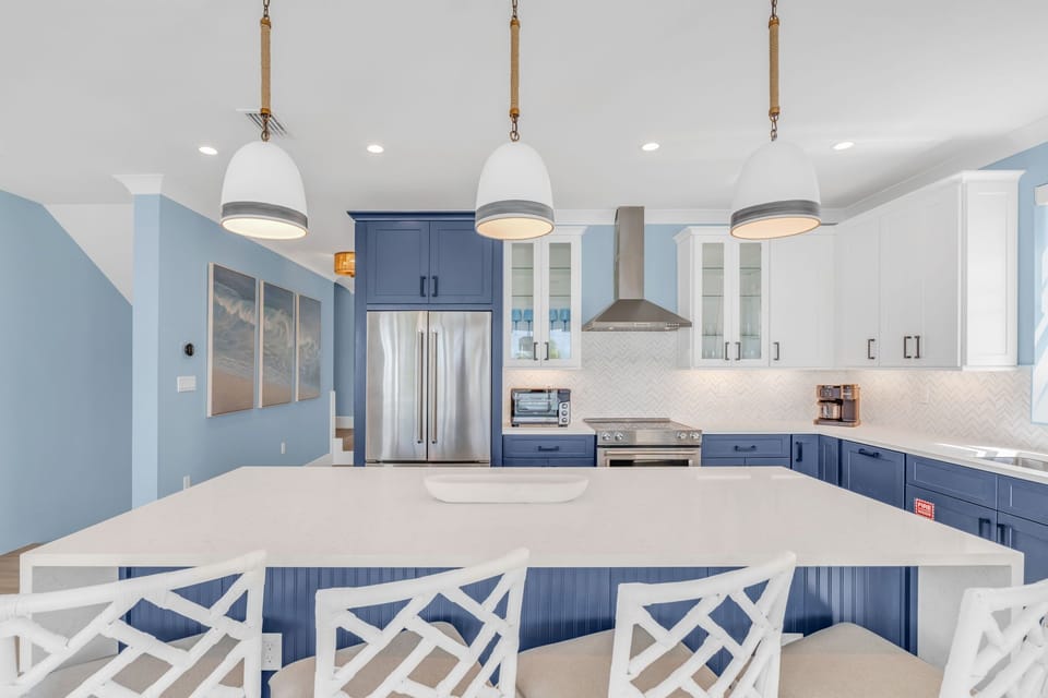 This spacious, open-concept kitchen offers stunning Gulf views and high-end finishes, perfect for cooking and entertaining during your Florida Keys vacation.