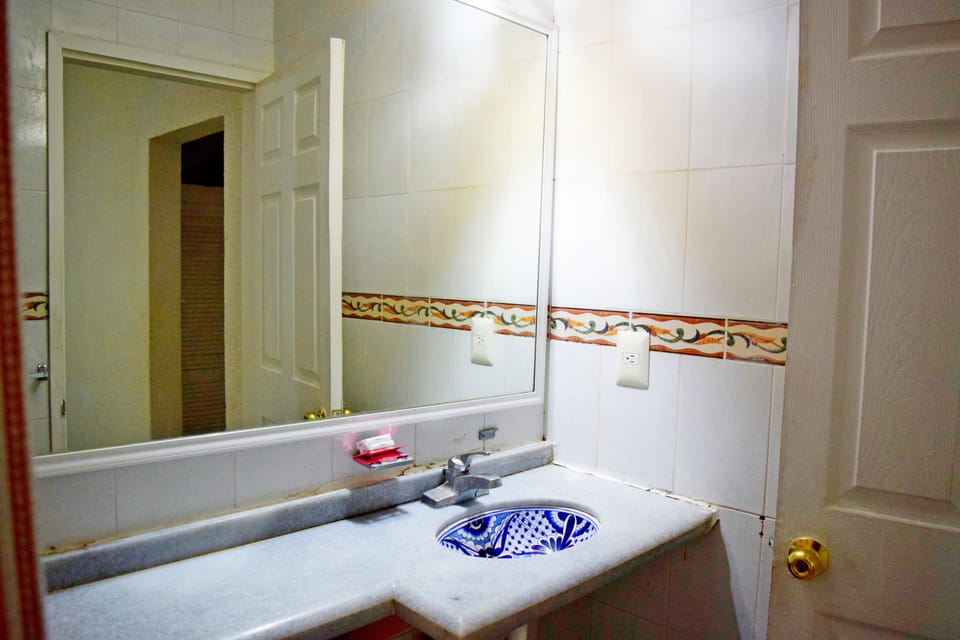 Family Room, 2 Double Beds | Bathroom | Shower, free toiletries, towels
