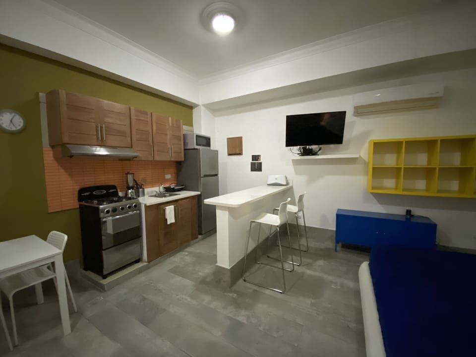 Fridge, stovetop, coffee/tea maker, cookware/dishes/utensils