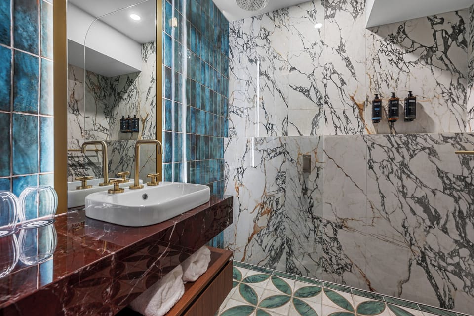 Shower, hair dryer, slippers, towels