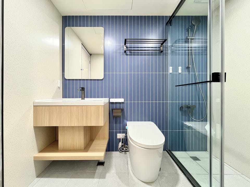 Basic Quadruple Room | Bathroom | Shower, hair dryer, slippers, towels
