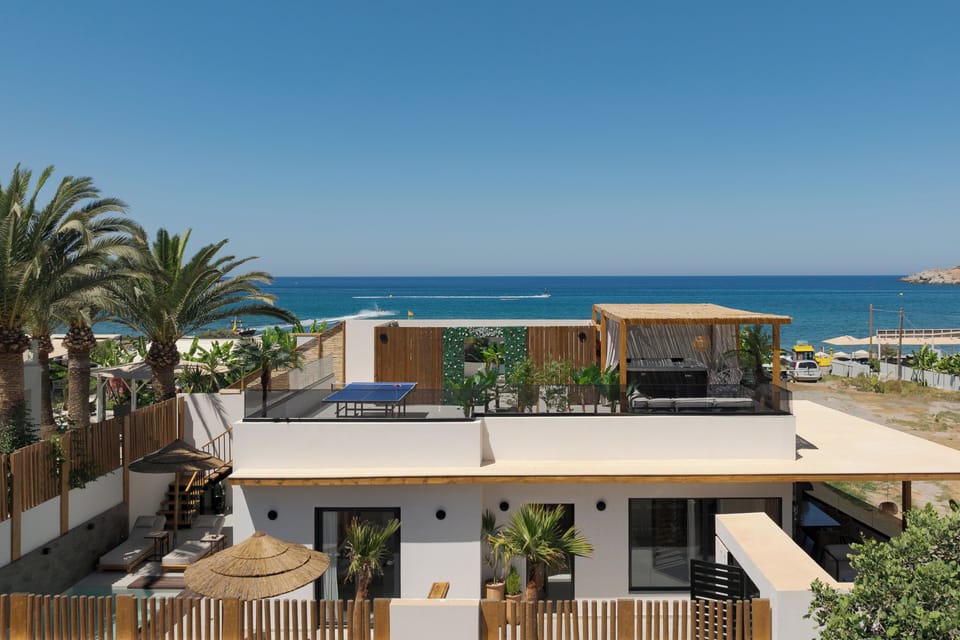Lush rooftop moments with spa whirlpool and coastal serenity all around.