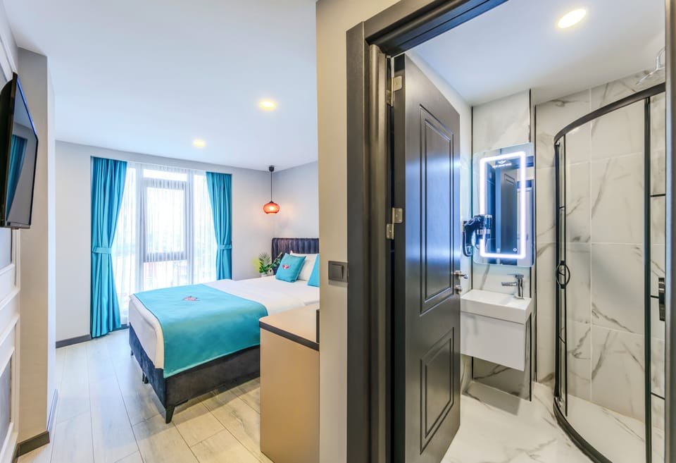Standard Double Room, City View | In-room safe, desk, laptop workspace, blackout drapes