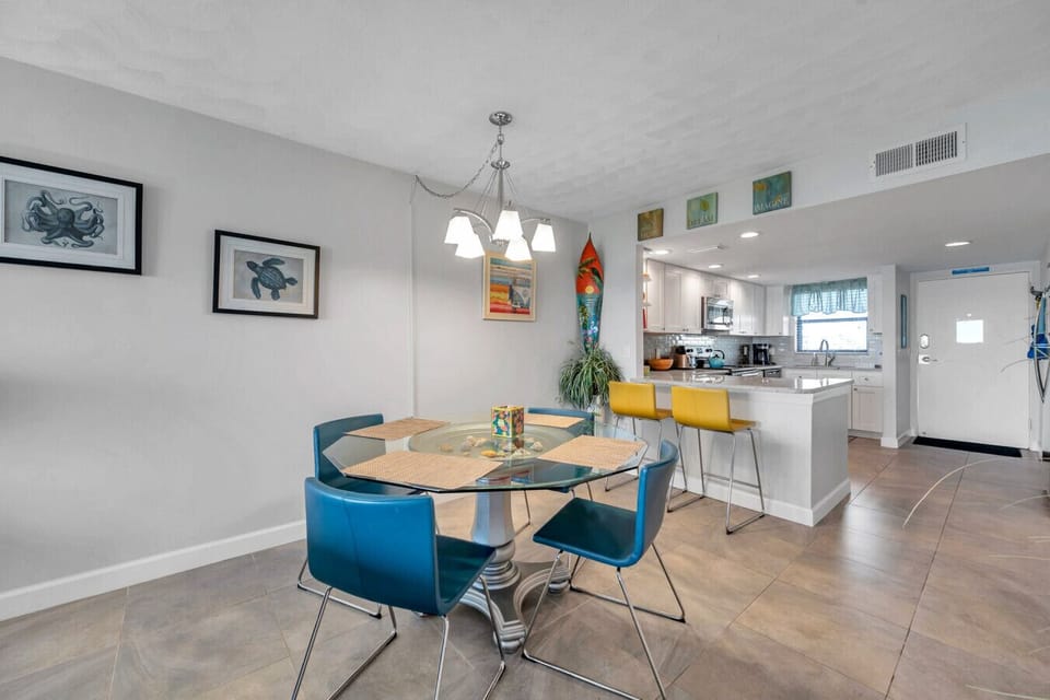 Gather around the dining table w/ an open kitchen that makes meals easy & social.