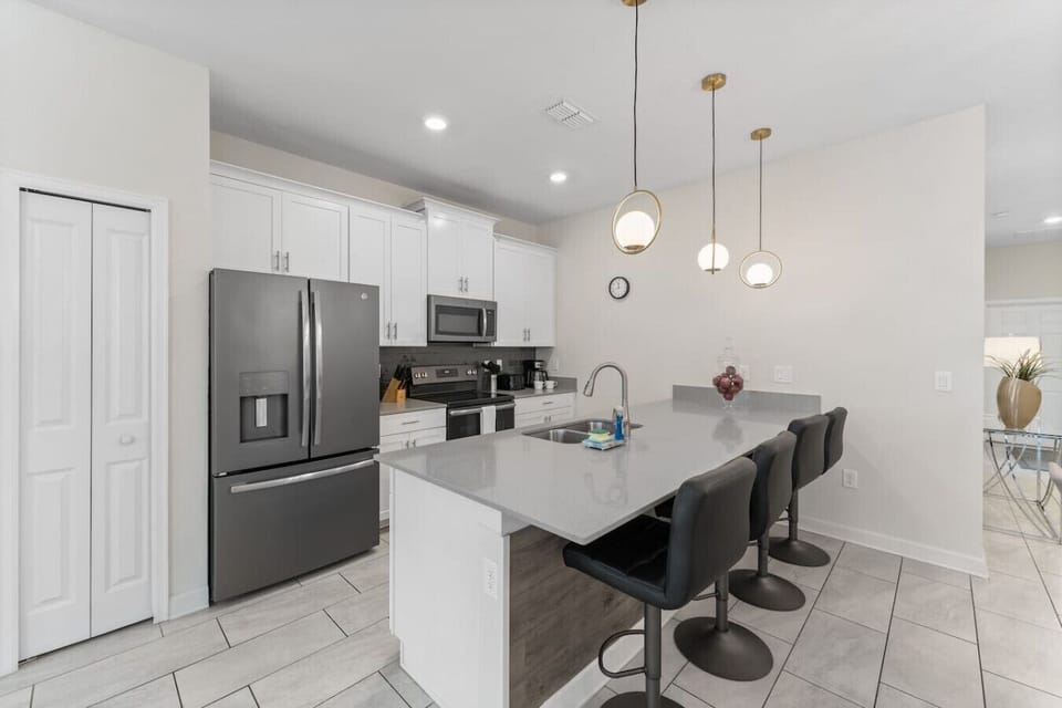 Kitchen Island with barstools for 4!#Disney #Parks #kingdom #springs #StoreyLake #Apartment #Vacation #Rental #waterpark #Kissimmee #Orlando #universal #citywalk