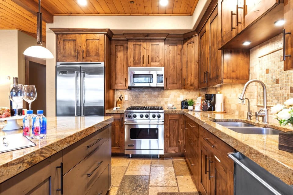Your fully equipped kitchen features granite counters, stainless appliances, and everything you need for homemade meals.
