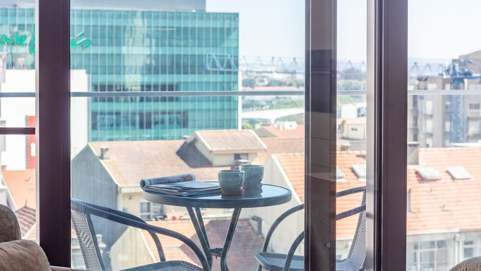 Sip your morning coffee while taking in sweeping views of the rooftops and beyond. #BalconyMorning #GaiaViewLife #AlFresco #UrbanEscapeStay