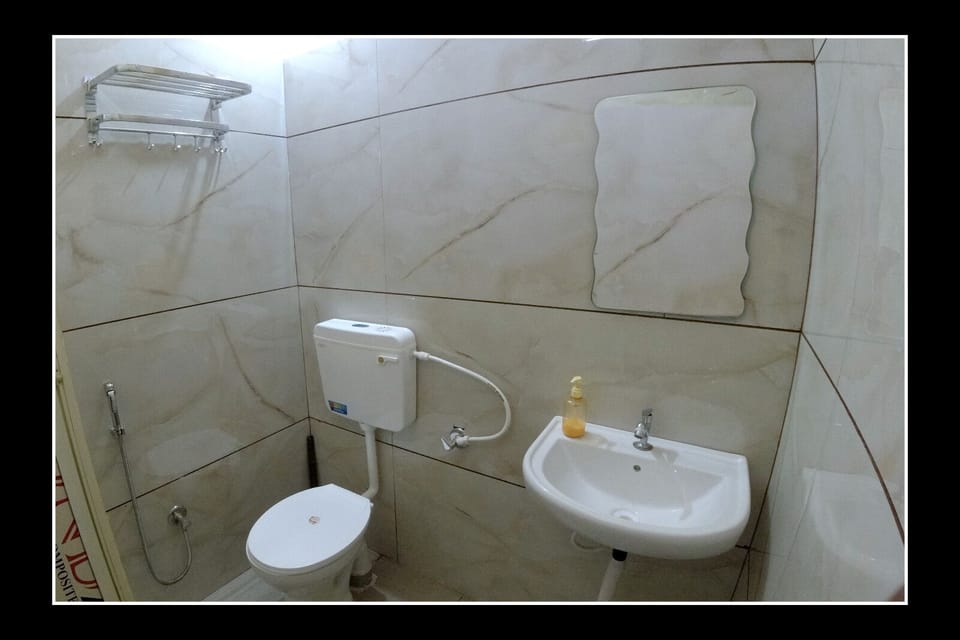 Shower, hair dryer, slippers, towels
