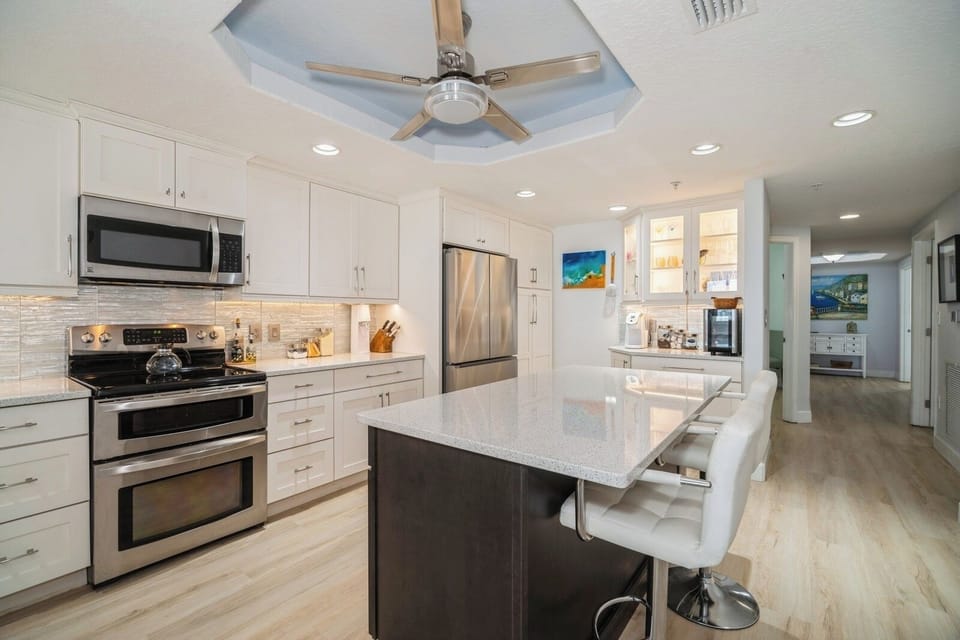 Refrigerator and dishwasher 2025.  Island and breakfast bar seating'