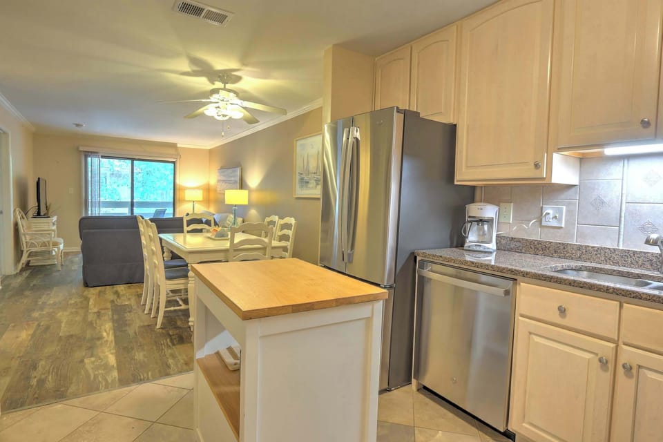 The bright, airy kitchen offers ample space & all the comforts of home