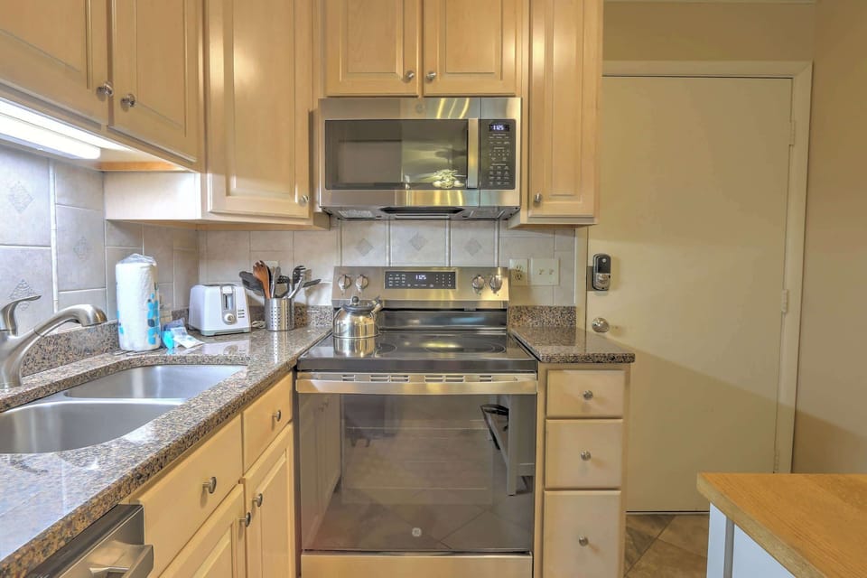 The bright, airy kitchen offers ample space & all the comforts of home