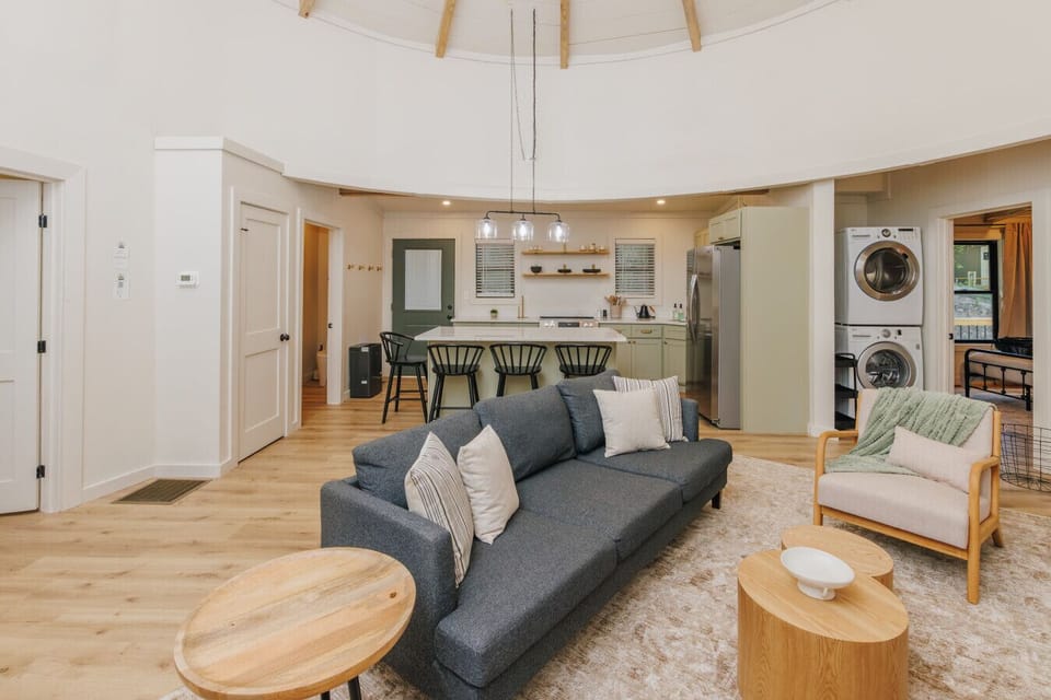 Unwind by the fireplace in a one-of-a-kind silo living room after a day in the Gorge