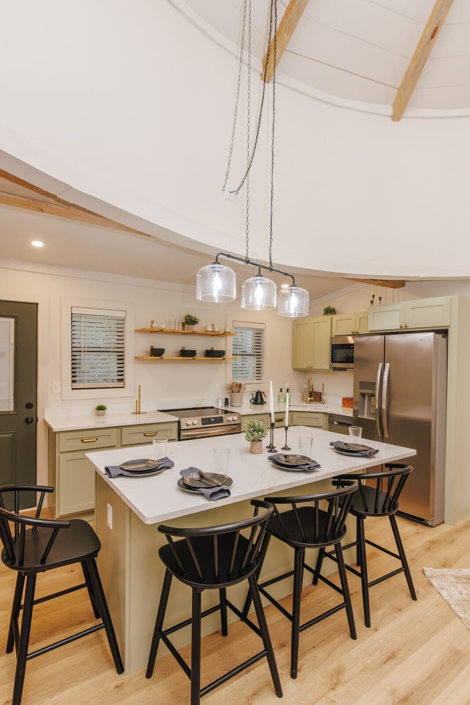 The modern kitchen island pairs stainless steel appliances with plenty of space to cook, dine, and connect—making every meal feel effortless.