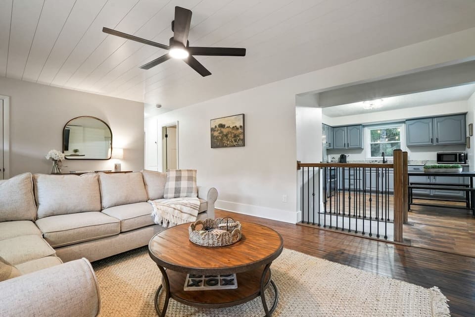Gather in a bright open living room with a soft & comfy sectional and warm wood floors. Just steps from the kitchen, it’s the perfect place to share meals and make memories together.