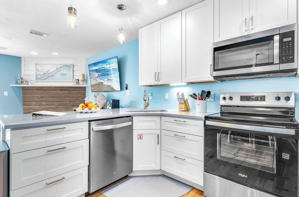 New kitchen cabinets and appliances and bar stool seating!