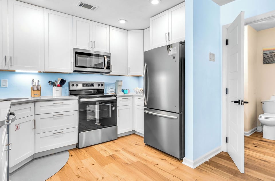 New kitchen cabinets and appliances and main level half bath!